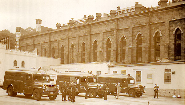 Raymond St. Jail: Inmate vans in yard.
