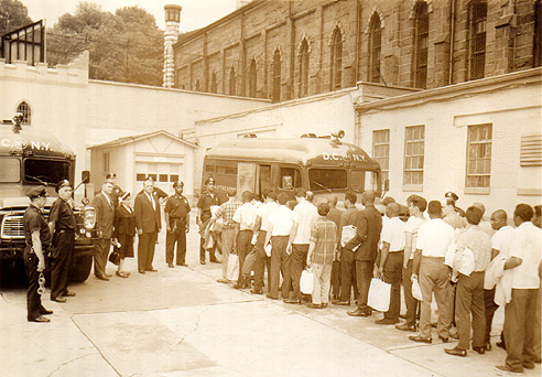 Raymond St. Jail: Inmates board vans
